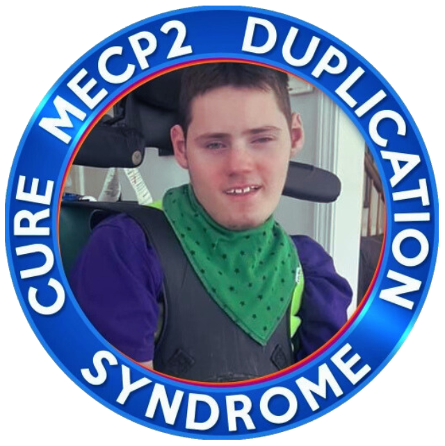 Badge with a boy in the middle that reads "Cure MECP2 Duplication Syntrome"